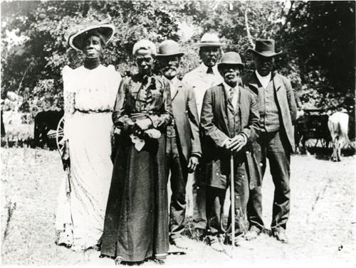 A Photo of several African Americans dressed up for a Juneteenth Celebration in 1900.