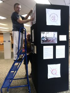 Hank Tusinski and Tim Mosman installing the exhibit.