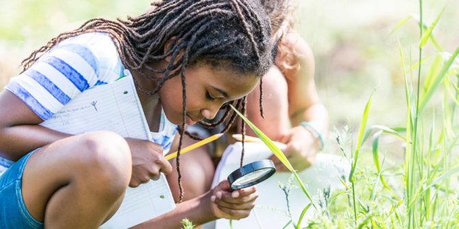 girl outdoor science bugs