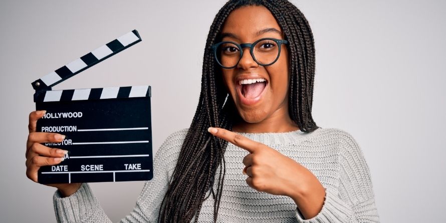 young teen female girl filmmaker with movie clapboard - rectangle young teen female girl filmmaker with movie clapboard - rectangle