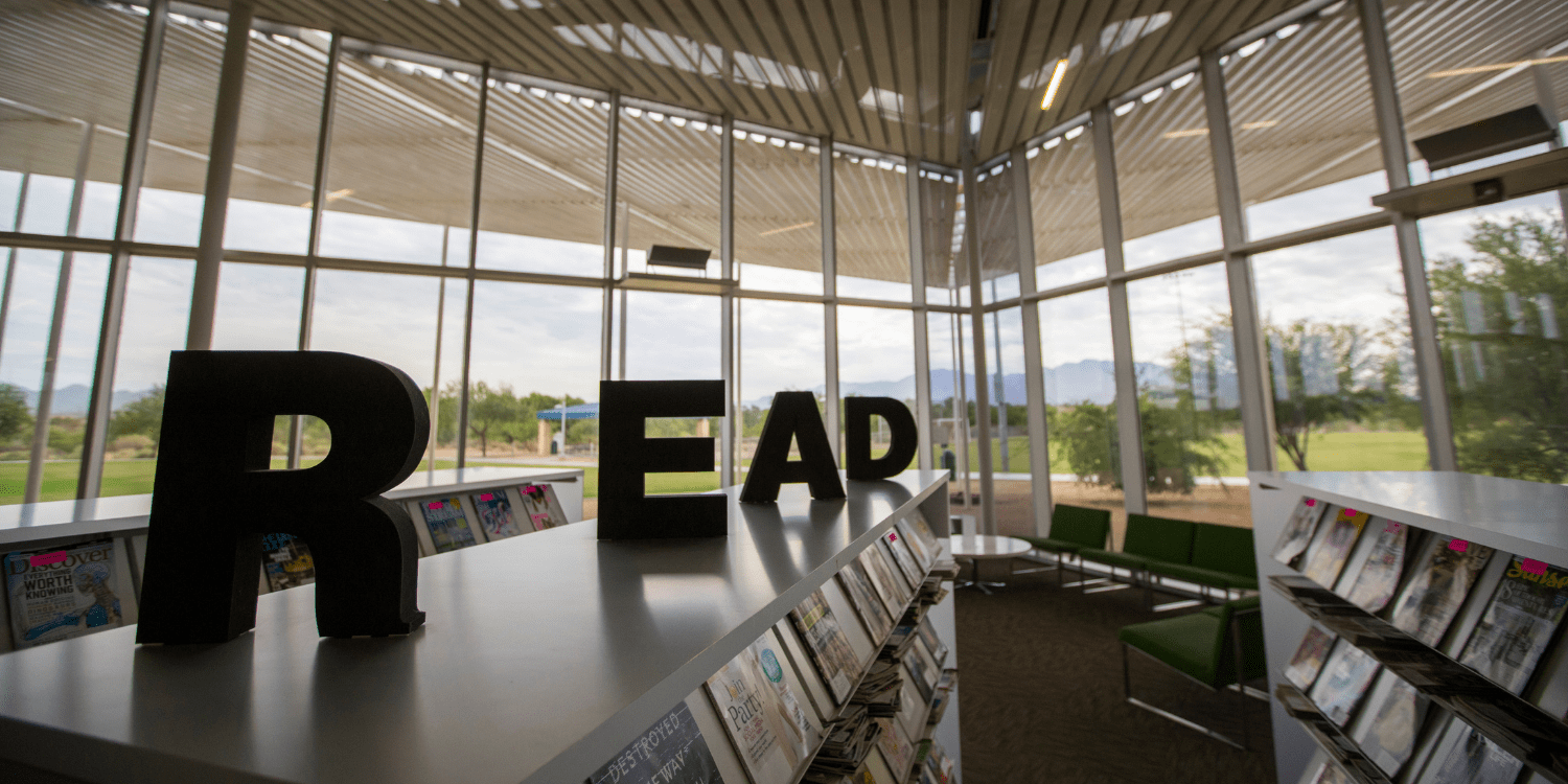 READ letters on top of bookshelves at Wheeler Taft Abbet Sr Library with windows behind