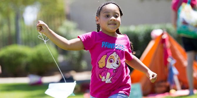 boy child girl outside at Teddy Bear picnic running after storytime